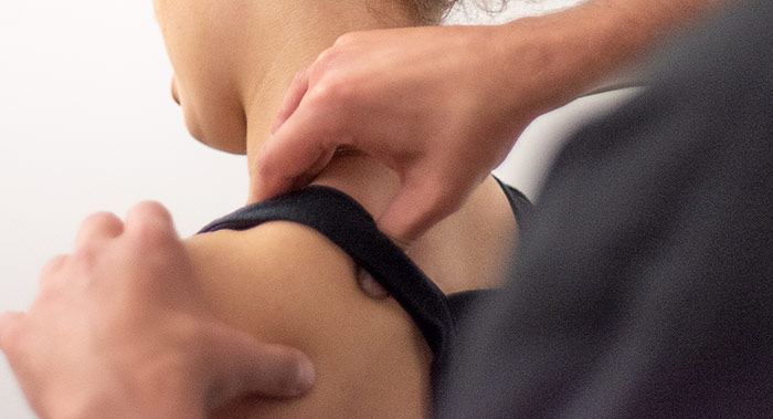 testing for a crossfit injury indicating a shoulder tear on a young woman